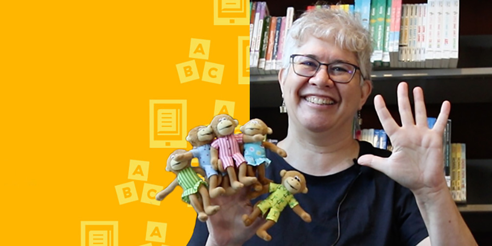 A woman with light hair and glasses holds up finger puppets showing five little monkeys.